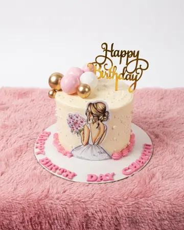 A cream buttercream cake with a hand-drawn illustration of two friends, topped with pink and gold spheres and a gold script topper.